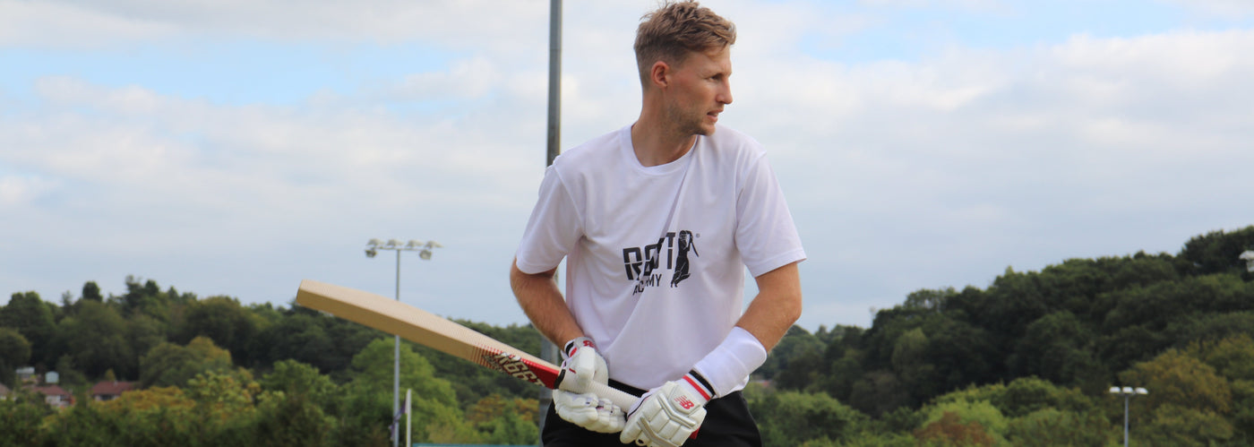 Joe Root holding a R66T Academy Technique Training Bat