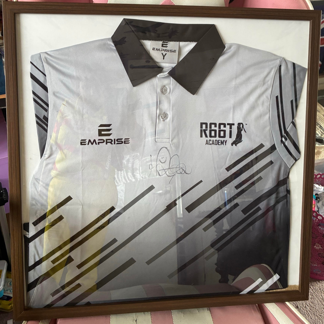 Membership prize features a grey R66T Academy Polo Shirt signed by Joe Root in a frame